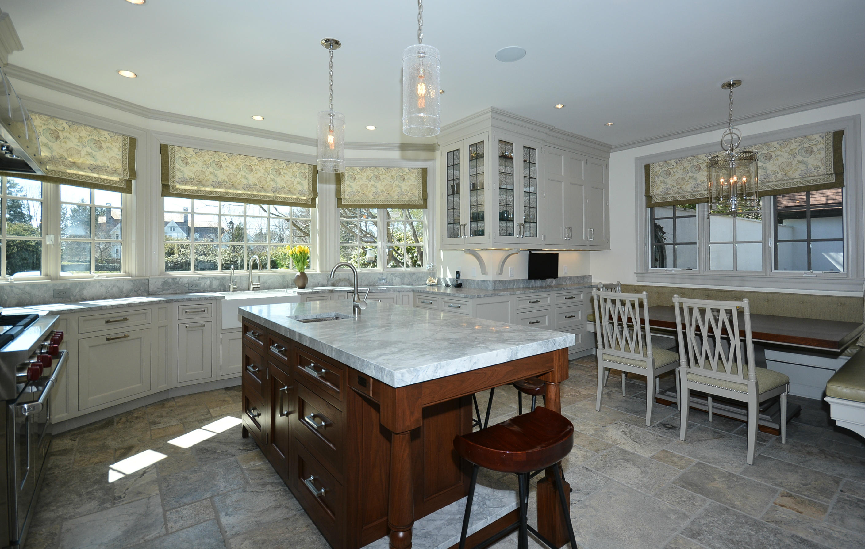 85 Rosebrook Road New Canaan, CT 06840 - Photo 7 of 27 a kitchen with a stove a table and chairs