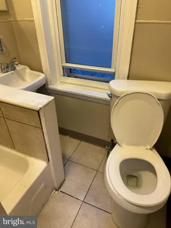 a bathroom with a sink and shower