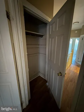 a view of staircase with wooden floor