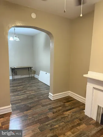 a view of a hardwood floor and a sink