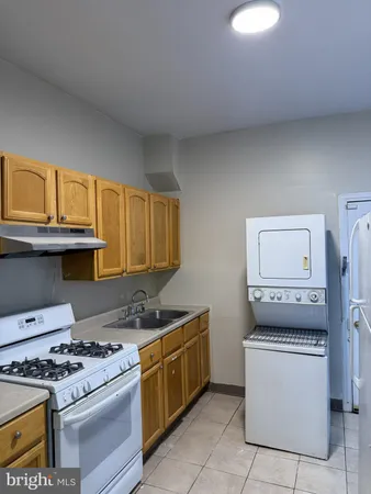 a kitchen with a stove and a sink
