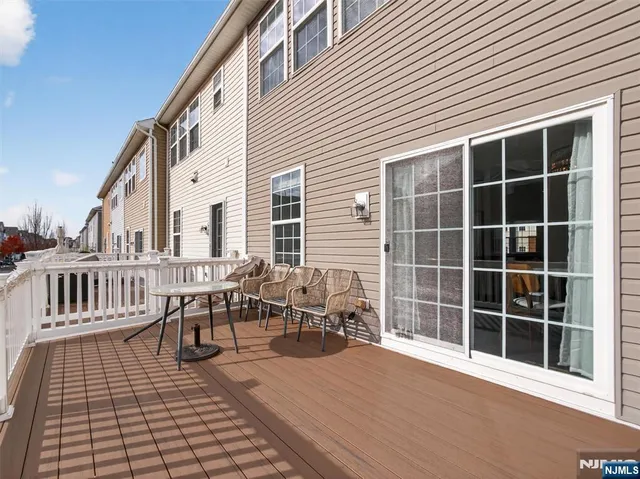 a outdoor view with a sitting space and large windows