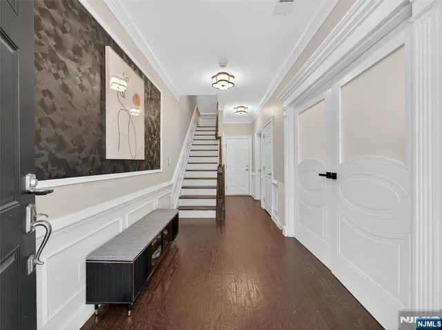 a view of an entryway with wooden floor