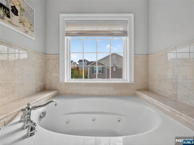 a bath tub sitting next to a window
