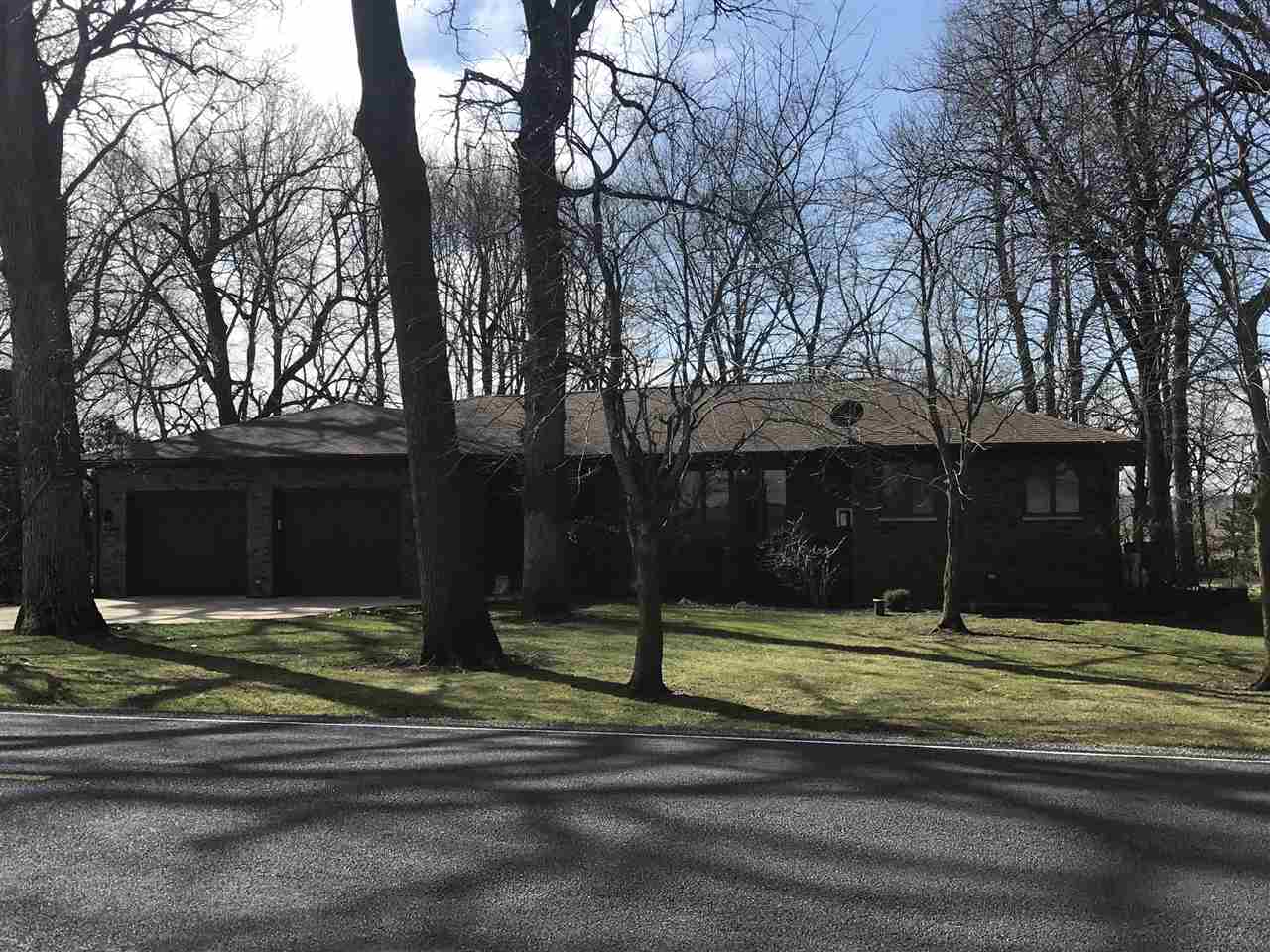 28945 Fulfs Road Sterling, IL 61081 - Photo 1 of 1 a house with trees in front of it
