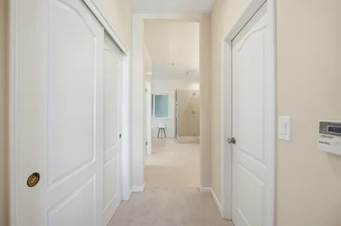 a spacious bathroom with sinks shower and a mirror