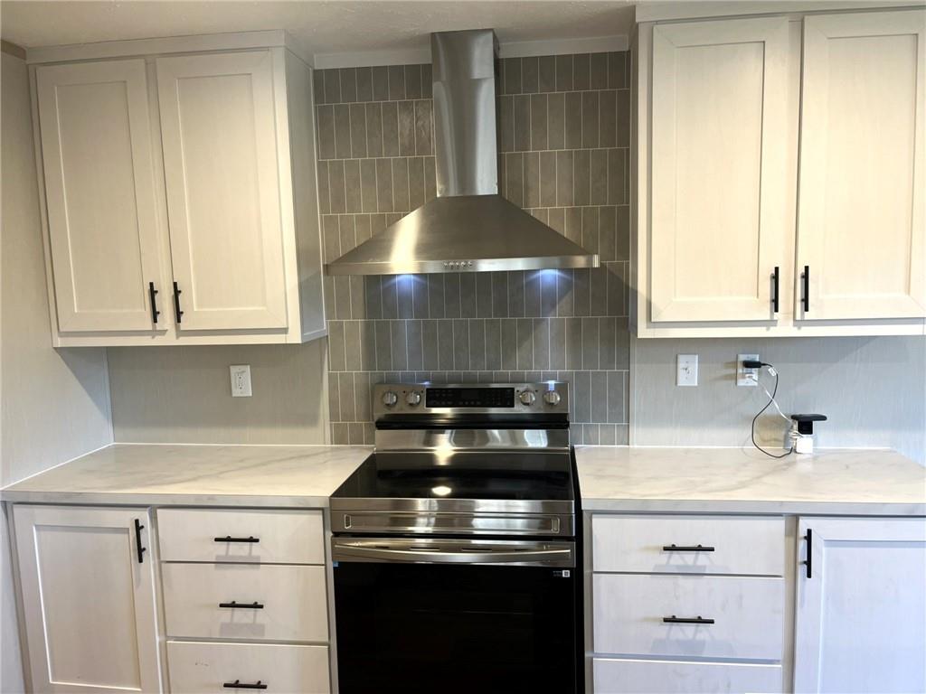 2860 Camp Road Jasper, GA 30143 - Photo 9 of 19 a stove top oven sitting inside of a kitchen