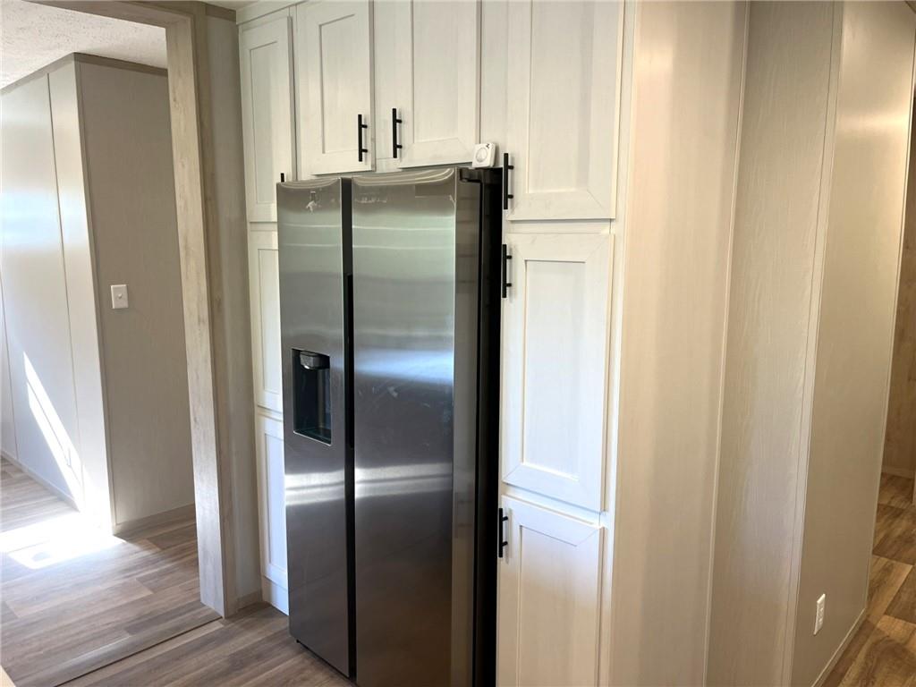 2860 Camp Road Jasper, GA 30143 - Photo 10 of 19 a metallic refrigerator freezer sitting in a kitchen