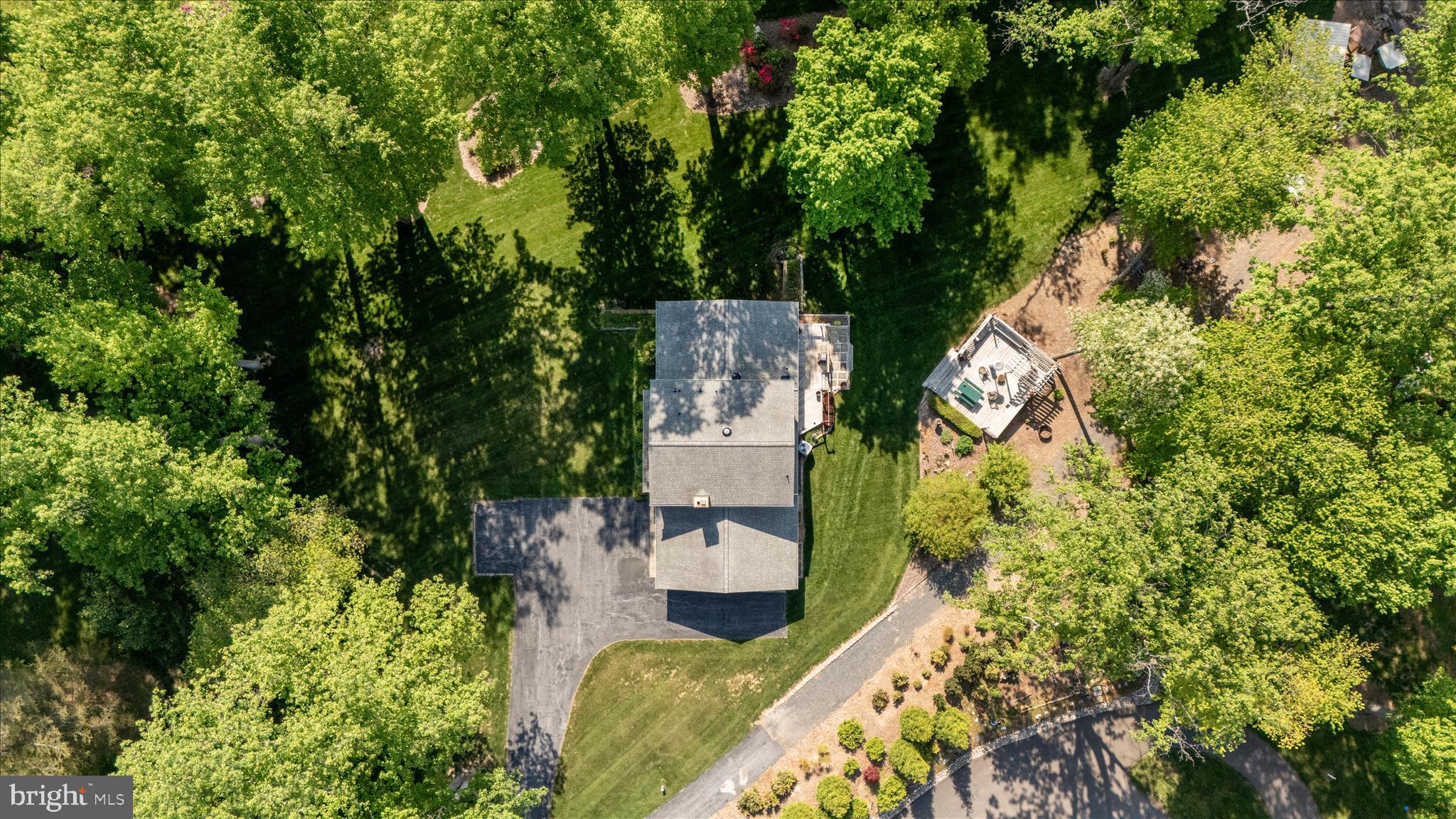13949 Brighton Dam Road Clarksville, MD 21029 - Photo 11 of 27 an aerial view of a house with swimming pool and garden