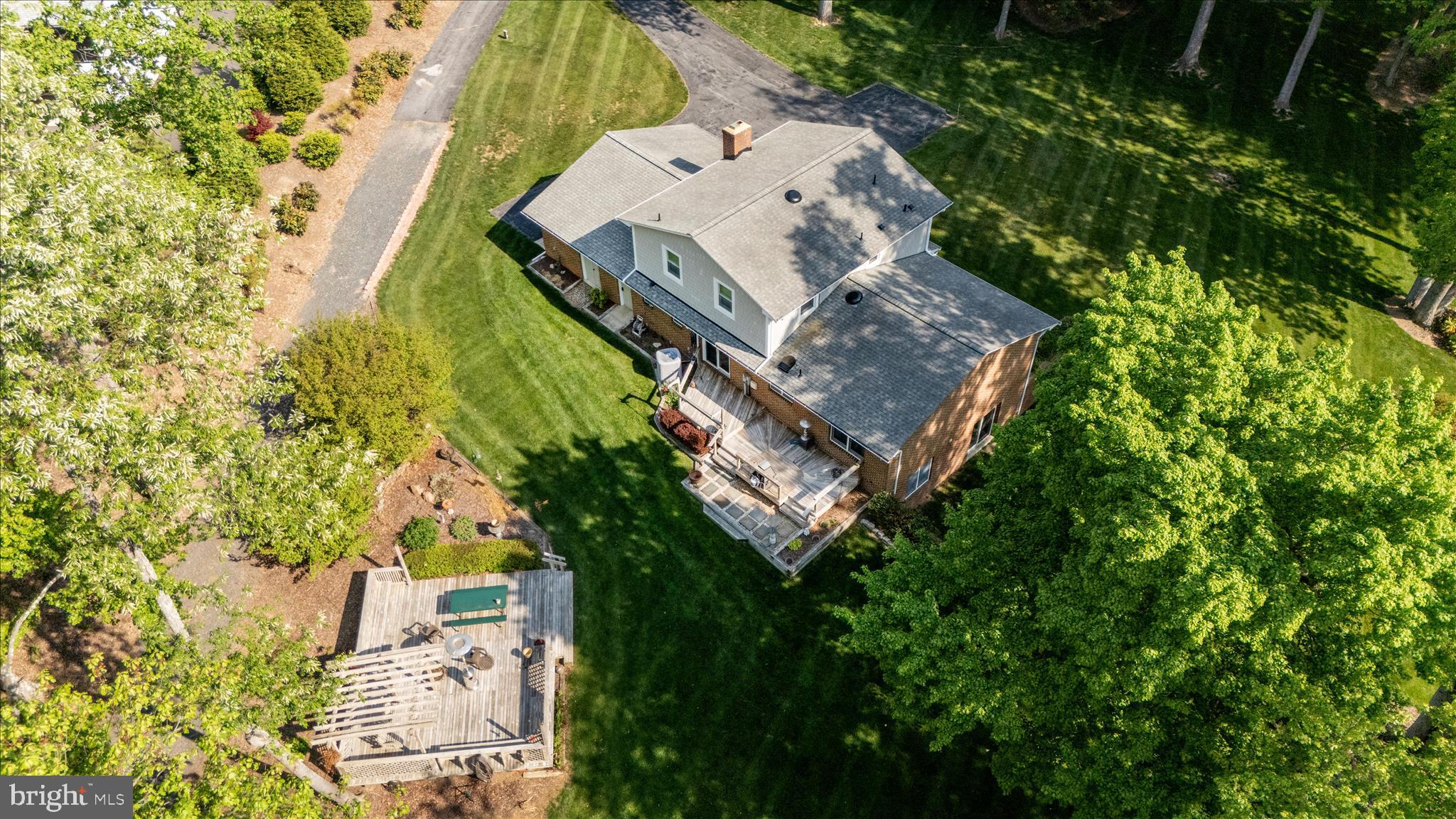 13949 Brighton Dam Road Clarksville, MD 21029 - Photo 12 of 27 an aerial view of a house with a yard and trees