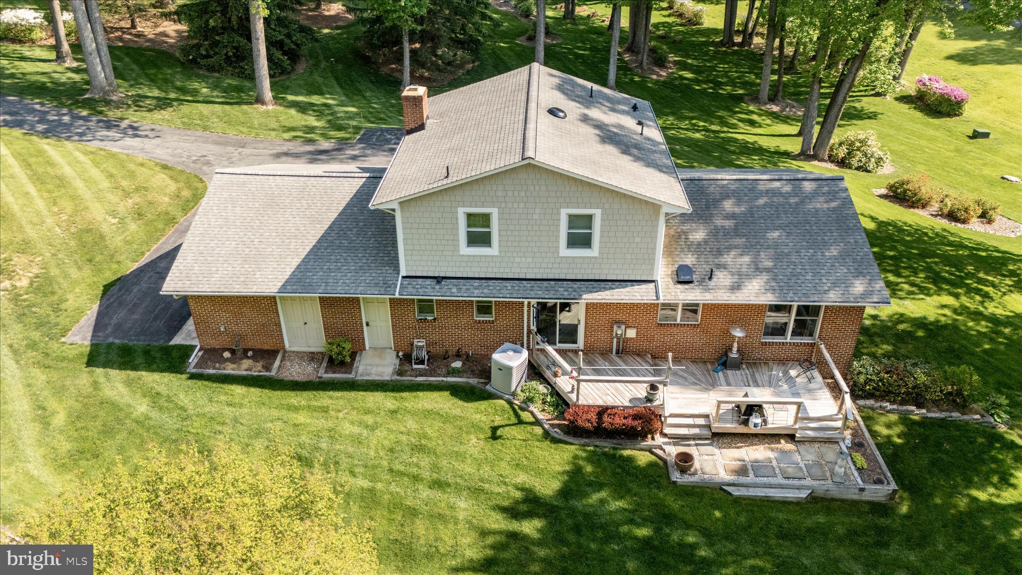 13949 Brighton Dam Road Clarksville, MD 21029 - Photo 14 of 27 an aerial view of a house with swimming pool and garden