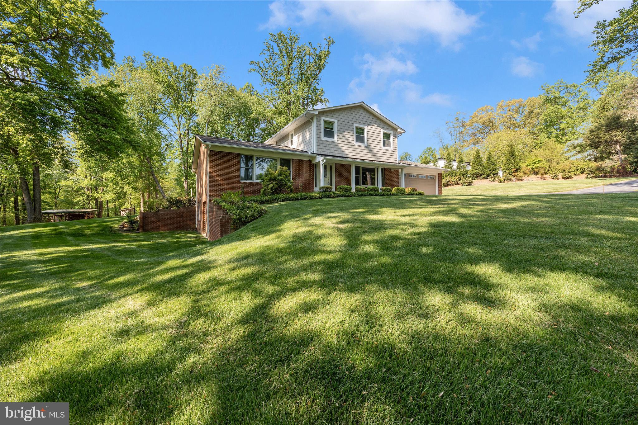 13949 Brighton Dam Road Clarksville, MD 21029 - Photo 18 of 27 a front view of a house with a garden