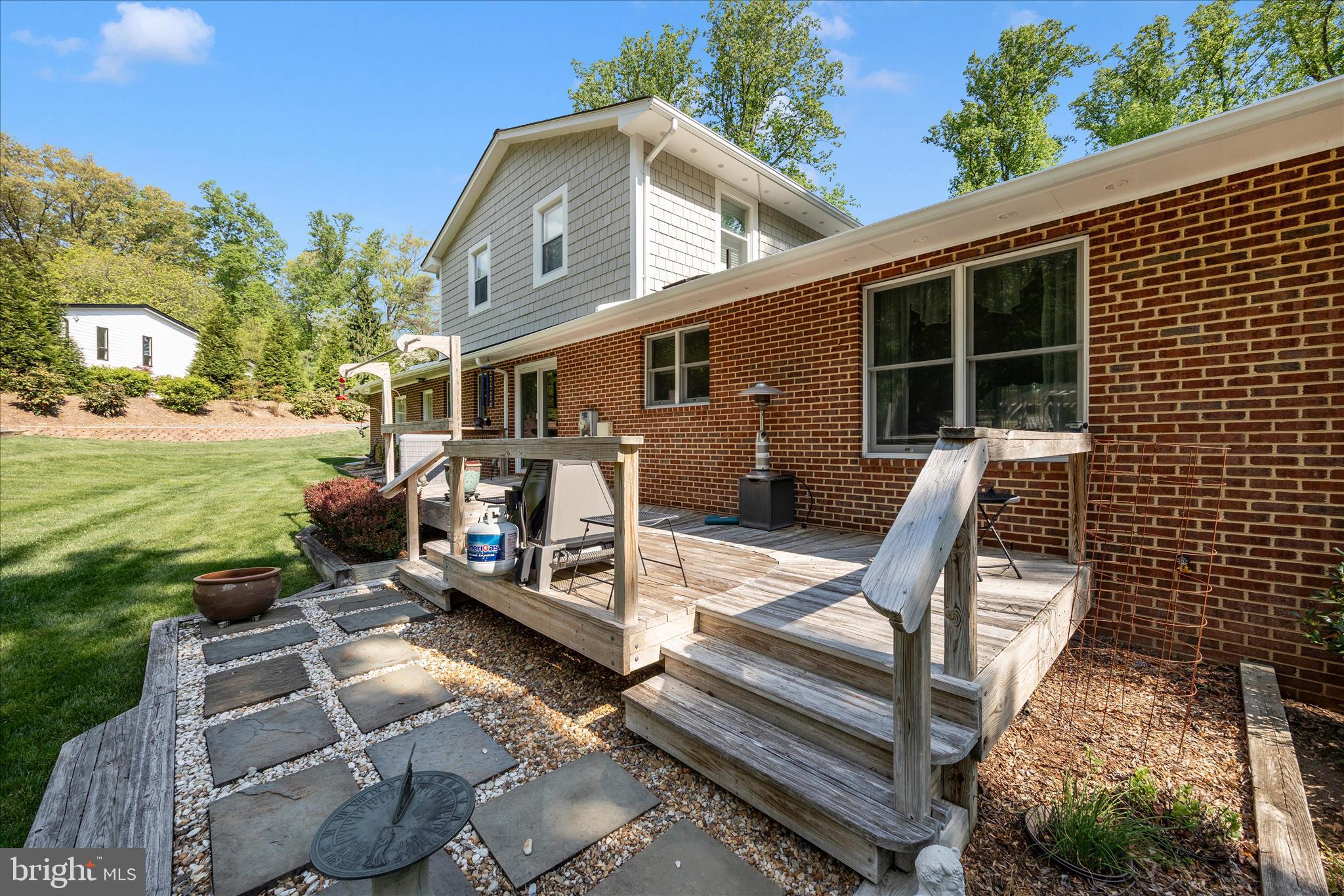 13949 Brighton Dam Road Clarksville, MD 21029 - Photo 19 of 27 a view of a patio with table and chairs with wooden floor and fence