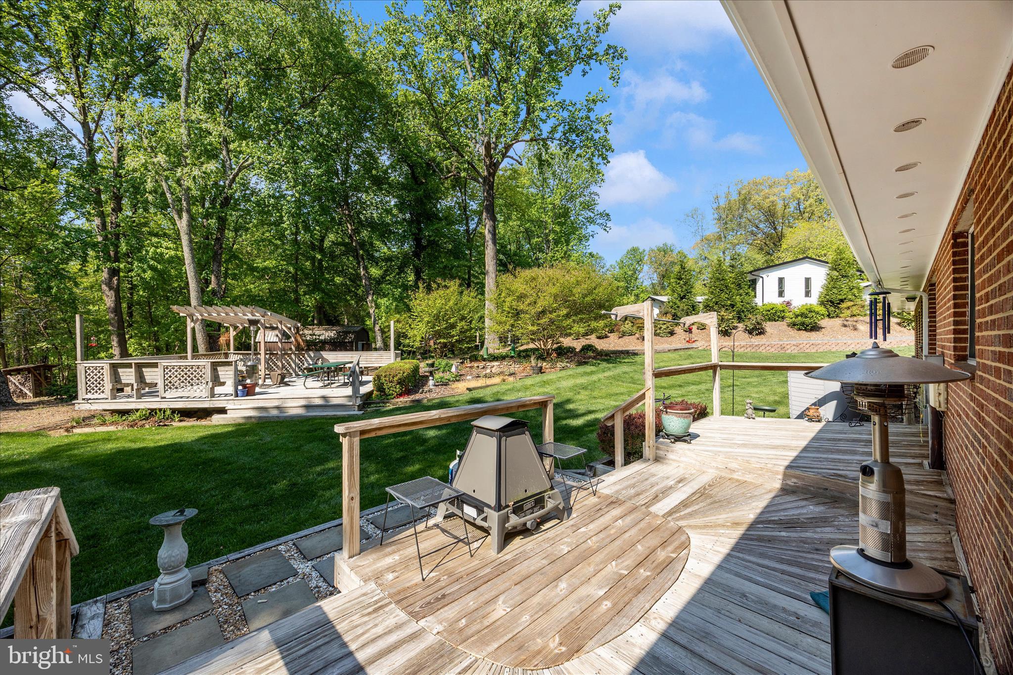13949 Brighton Dam Road Clarksville, MD 21029 - Photo 20 of 27 a view of a patio with chairs and table with chairs