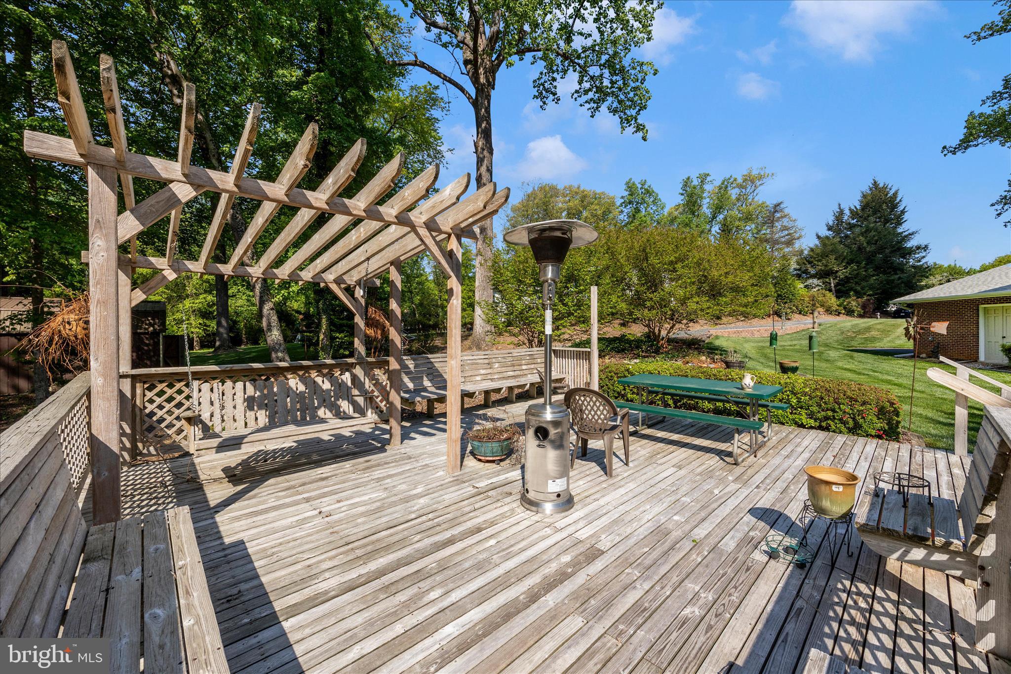 13949 Brighton Dam Road Clarksville, MD 21029 - Photo 21 of 27 a view of balcony with wooden floor and outdoor seating