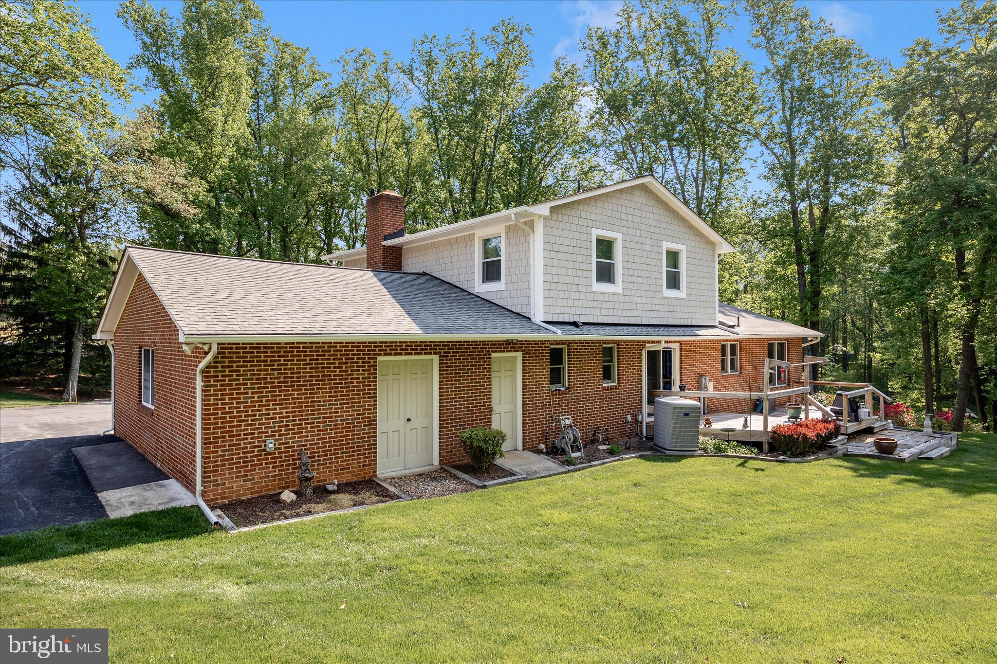 13949 Brighton Dam Road Clarksville, MD 21029 - Photo 24 of 27 a front view of a house with a yard and trees