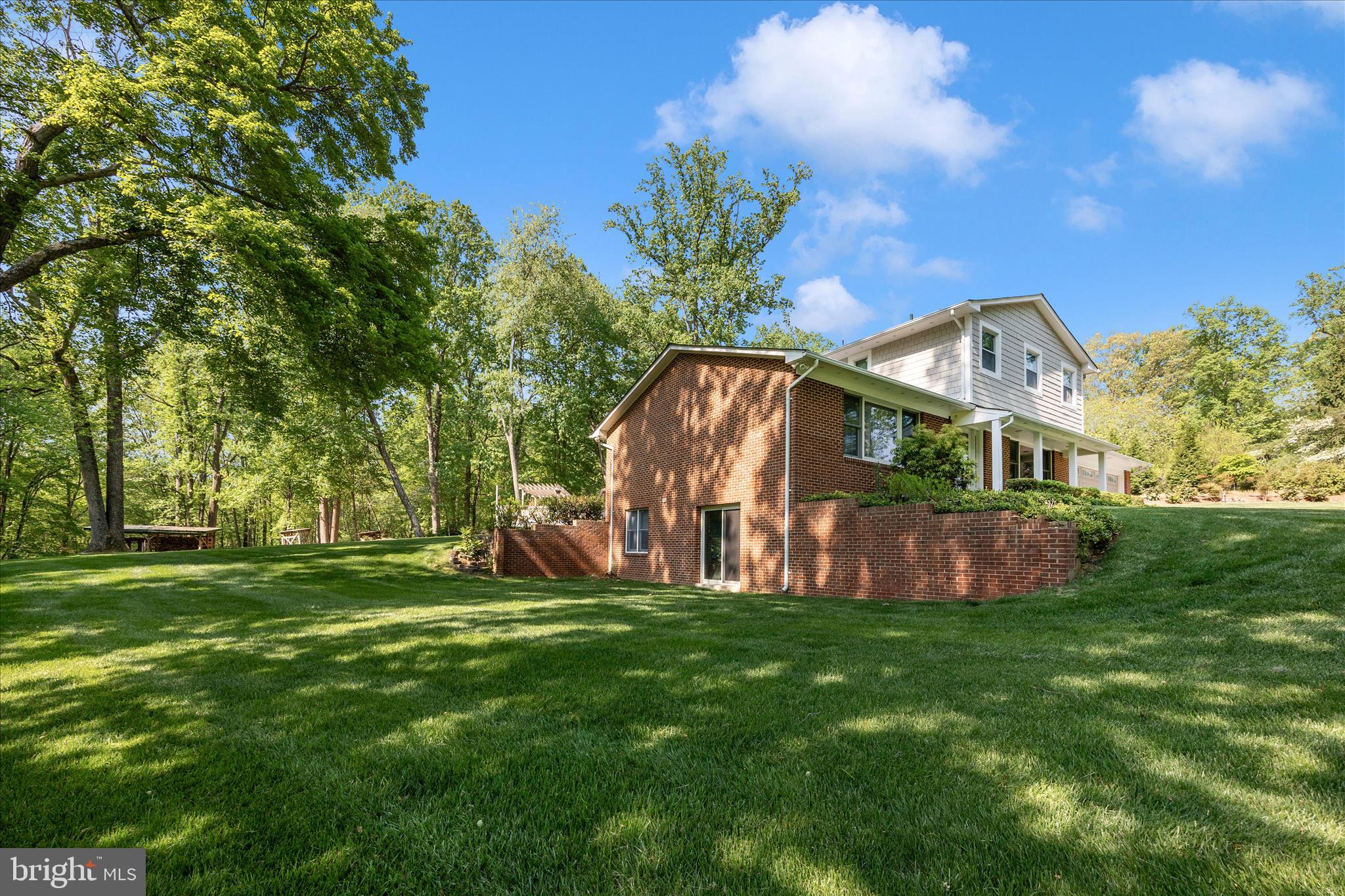 13949 Brighton Dam Road Clarksville, MD 21029 - Photo 27 of 27 a view of a house with a big yard potted plants and large tree