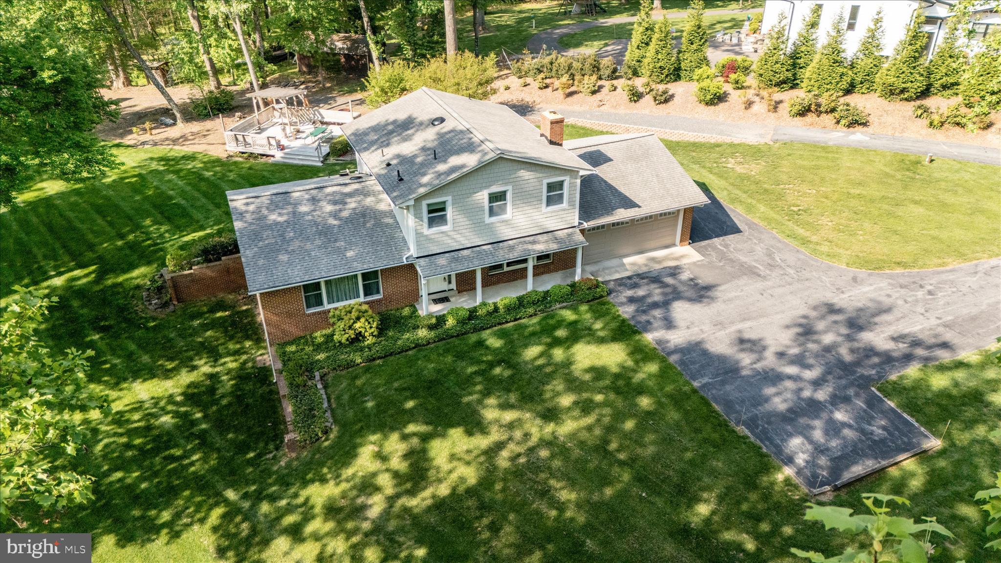 13949 Brighton Dam Road Clarksville, MD 21029 - Photo 6 of 27 a aerial view of a house with a yard and sitting area