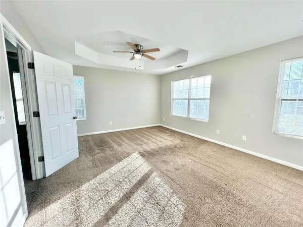 a view of empty room with windows