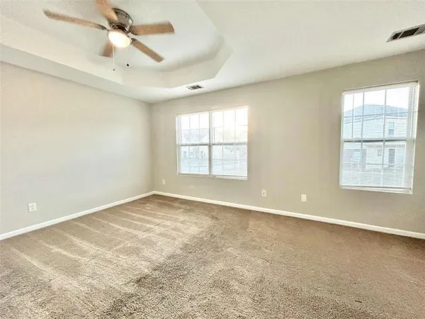 a view of an empty room with a window