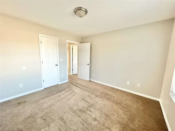 an empty room with a empty space and a window