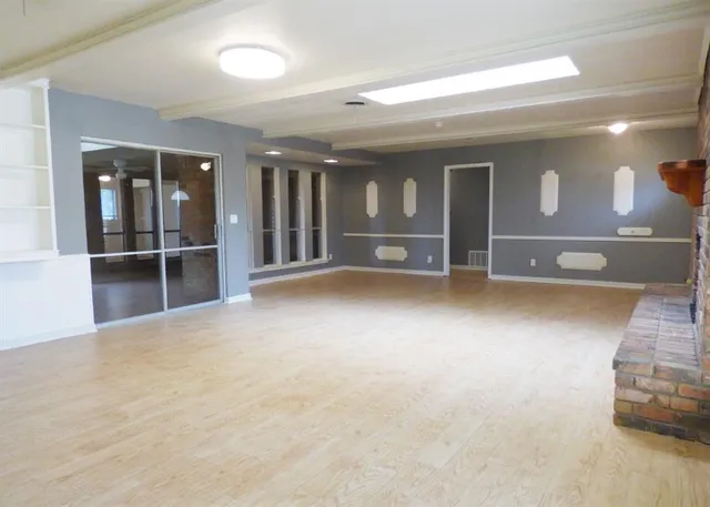 a view of an empty room and window