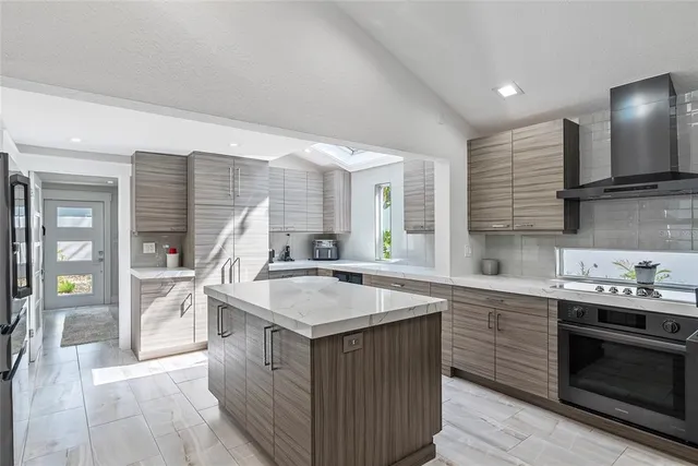 a kitchen with a sink stove and cabinets