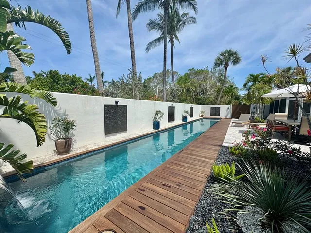 a view of a swimming pool with a patio