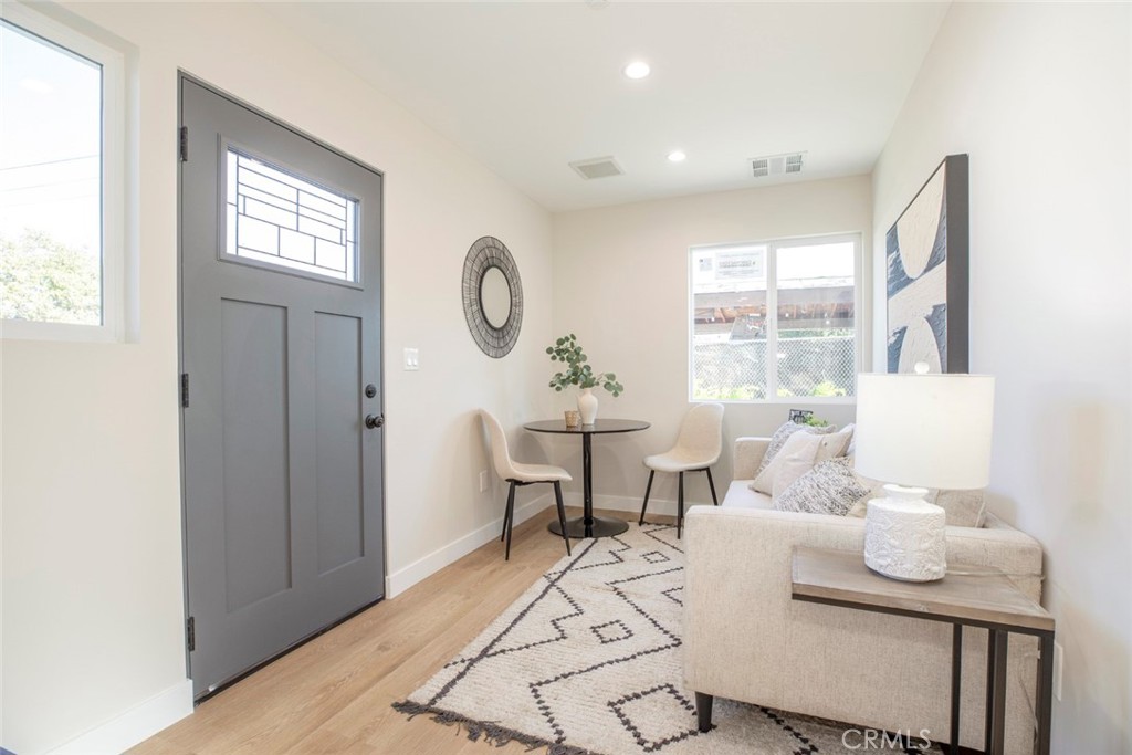 8879 Morehart Avenue Sun Valley, CA 91352 - Photo 2 of 13 a living room with furniture a window and a table