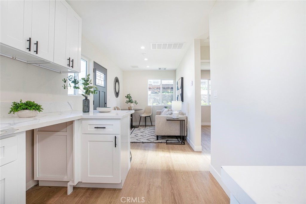 8879 Morehart Avenue Sun Valley, CA 91352 - Photo 9 of 13 a kitchen with white cabinets and counter space