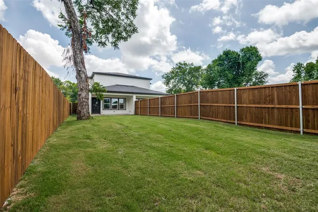 a view of a yard with an outdoor space