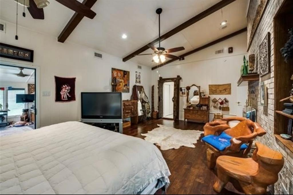 6049 West Red Bird Lane Dallas, TX 75236 - Photo 17 of 34 a bedroom with furniture and a flat screen tv