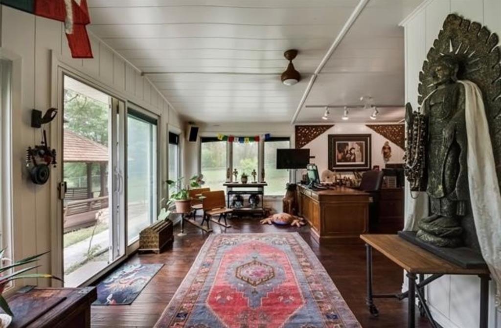 6049 West Red Bird Lane Dallas, TX 75236 - Photo 21 of 34 a living room with furniture a rug and a floor to ceiling window