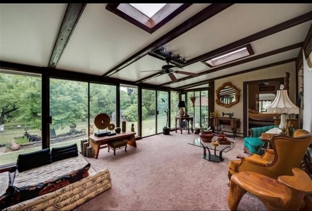 6049 West Red Bird Lane Dallas, TX 75236 - Photo 26 of 34 a living room with furniture and a large window