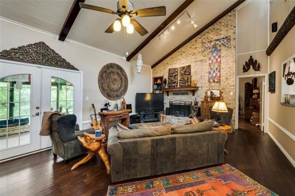 6049 West Red Bird Lane Dallas, TX 75236 - Photo 5 of 34 a living room with fireplace furniture and a large window