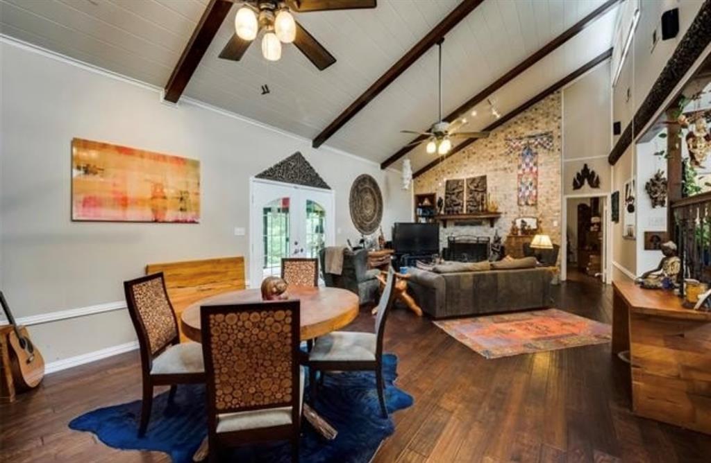 6049 West Red Bird Lane Dallas, TX 75236 - Photo 10 of 34 a view of a dining room with furniture a rug and wooden floor