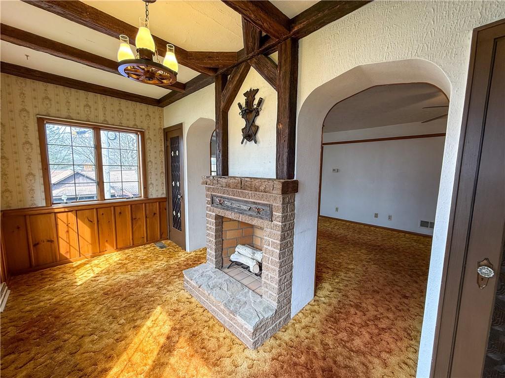 122 Lower Troy Hill Road Kittanning, PA 16201 - Photo 12 of 42 a view of a livingroom with wooden floor and a fireplace