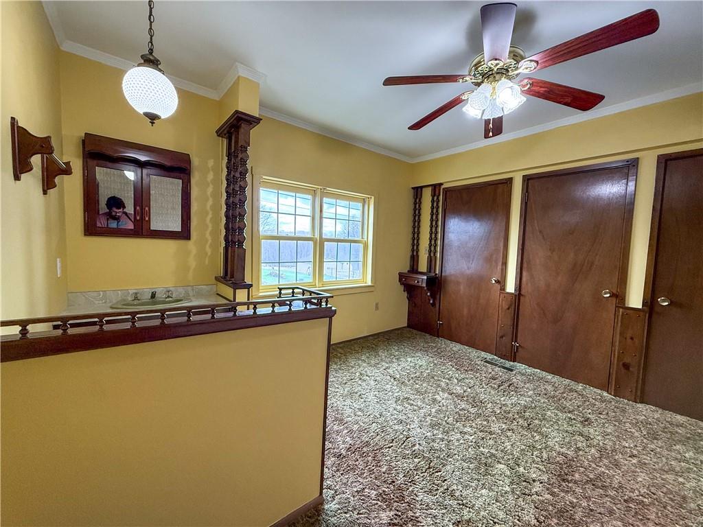 122 Lower Troy Hill Road Kittanning, PA 16201 - Photo 20 of 42 a view of a livingroom with a chandelier fan and windows