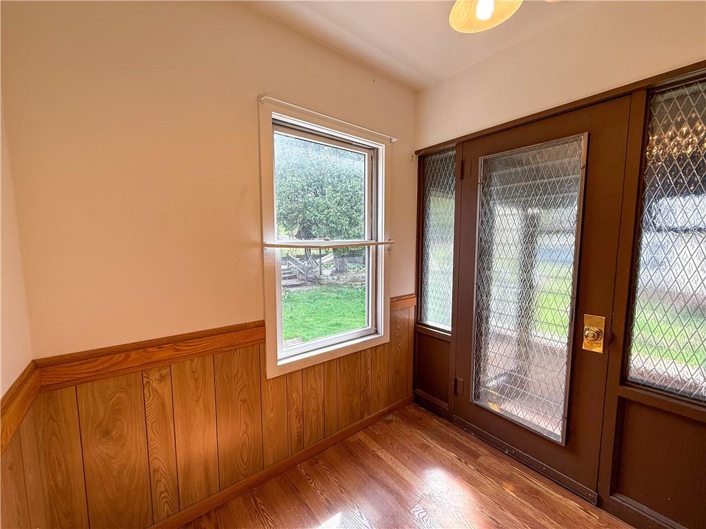 122 Lower Troy Hill Road Kittanning, PA 16201 - Photo 2 of 42 a view of an empty room with wooden floor and a window