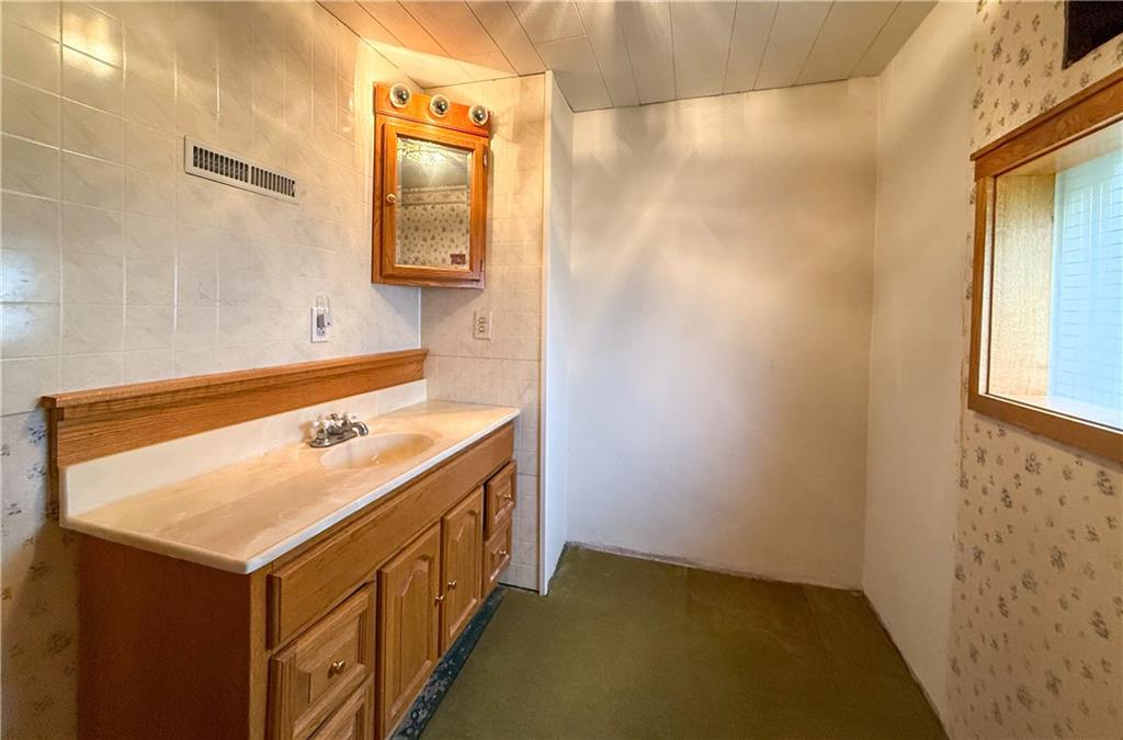 122 Lower Troy Hill Road Kittanning, PA 16201 - Photo 27 of 42 a bathroom with a sink and a mirror