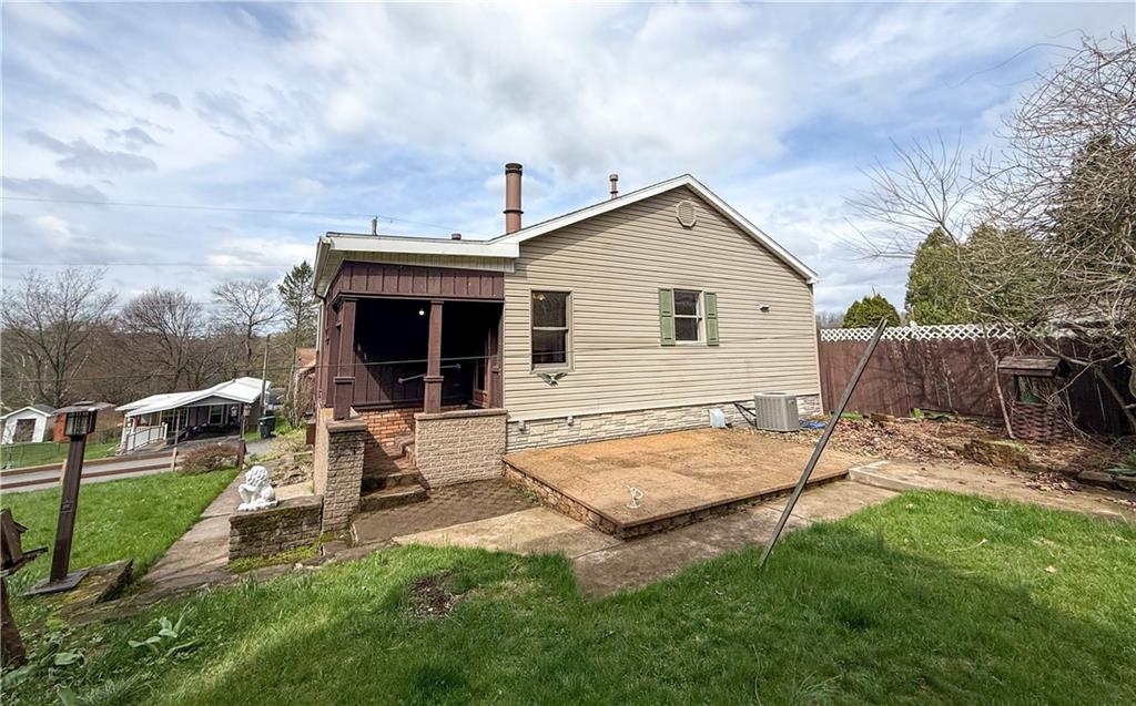 122 Lower Troy Hill Road Kittanning, PA 16201 - Photo 34 of 42 a backyard of a house with table and chairs
