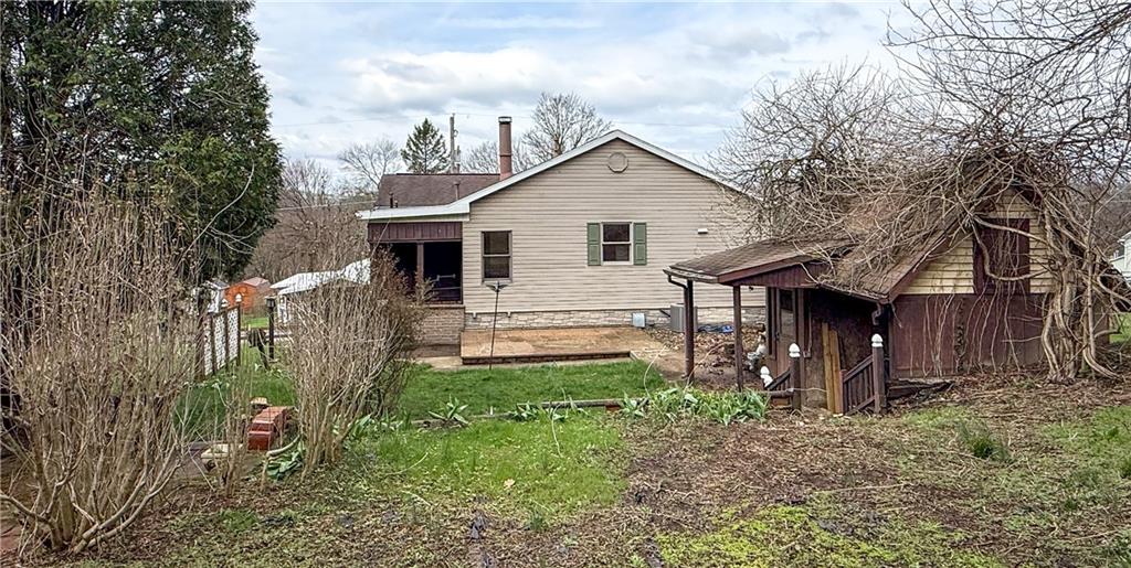 122 Lower Troy Hill Road Kittanning, PA 16201 - Photo 36 of 42 a view of a house with a yard and lawn chairs