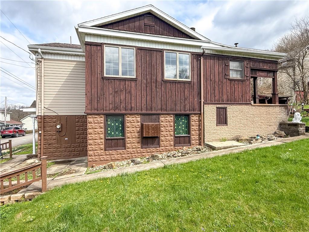 122 Lower Troy Hill Road Kittanning, PA 16201 - Photo 40 of 42 a front view of a house with a yard and garage