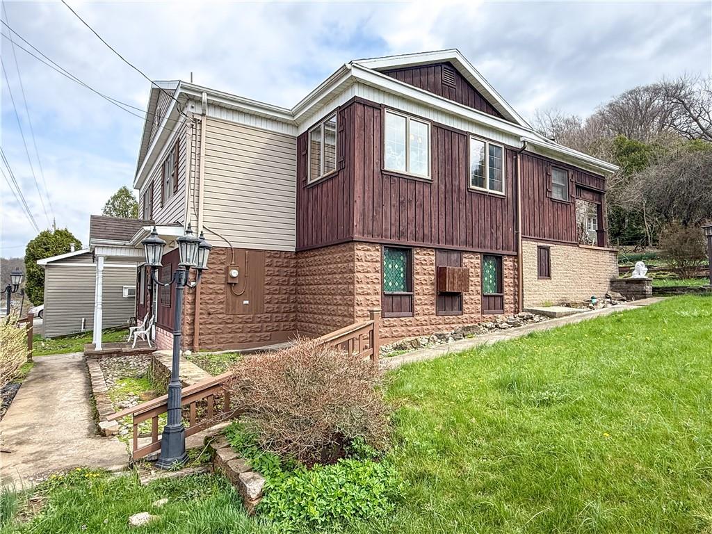 122 Lower Troy Hill Road Kittanning, PA 16201 - Photo 41 of 42 a front view of a house with a yard