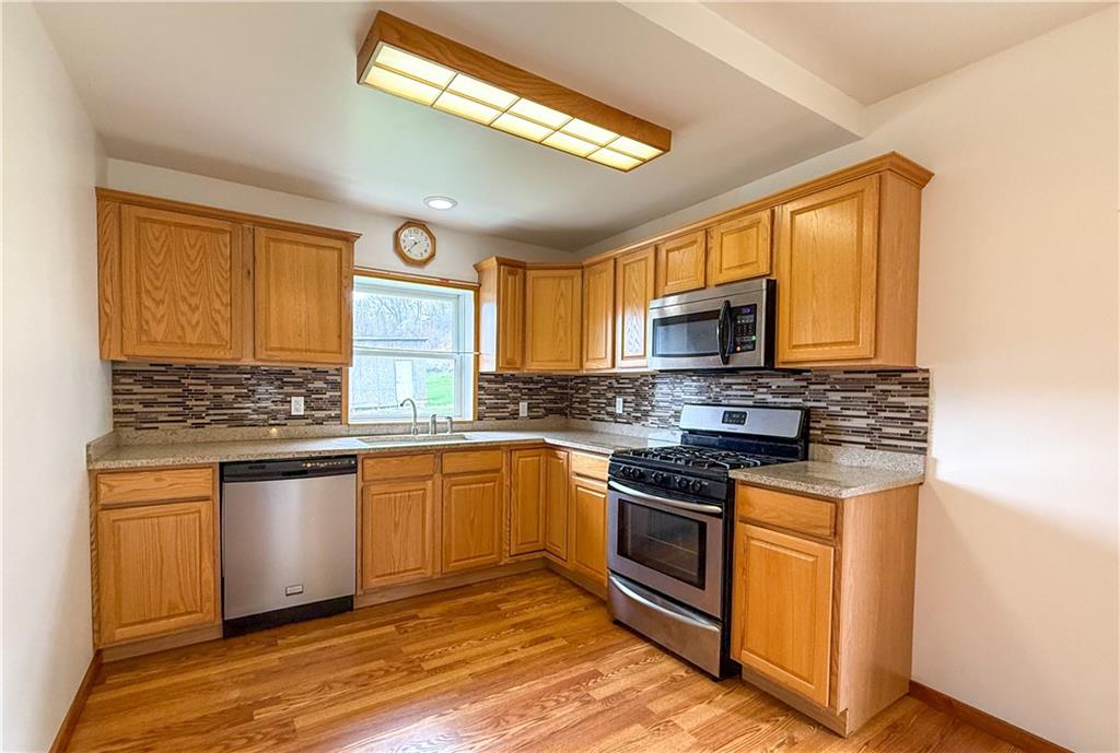 122 Lower Troy Hill Road Kittanning, PA 16201 - Photo 6 of 42 a kitchen with stainless steel appliances granite countertop a stove and a sink