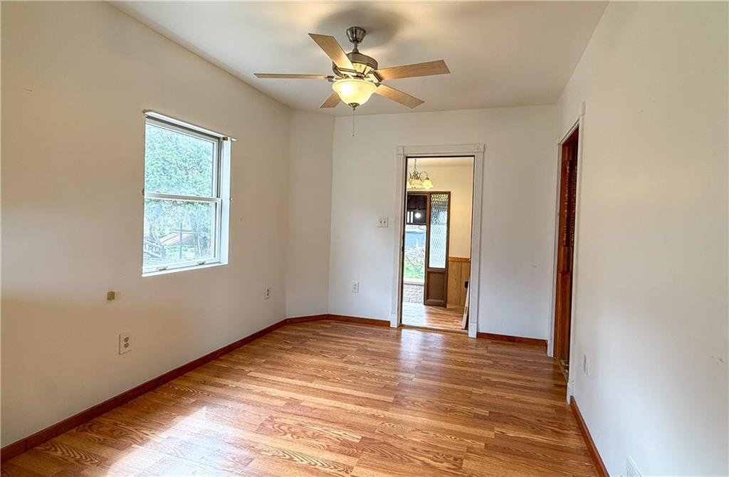 122 Lower Troy Hill Road Kittanning, PA 16201 - Photo 8 of 42 an empty room with fan and windows