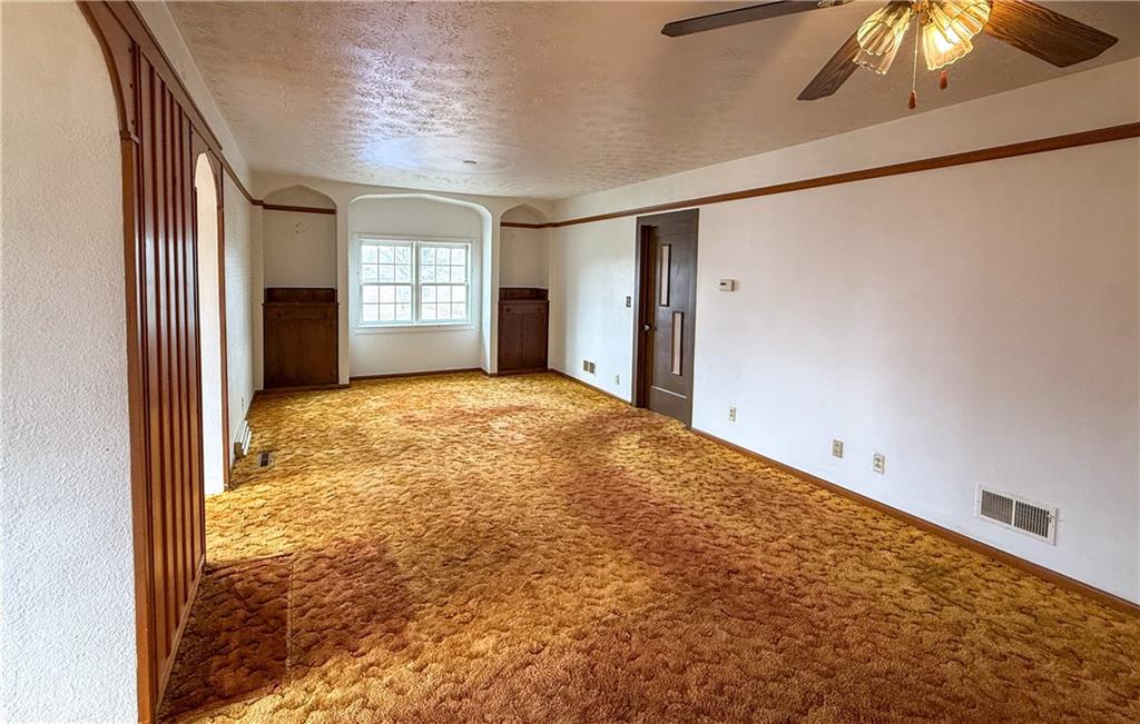 122 Lower Troy Hill Road Kittanning, PA 16201 - Photo 10 of 42 a view of an empty room with window and chandelier fan