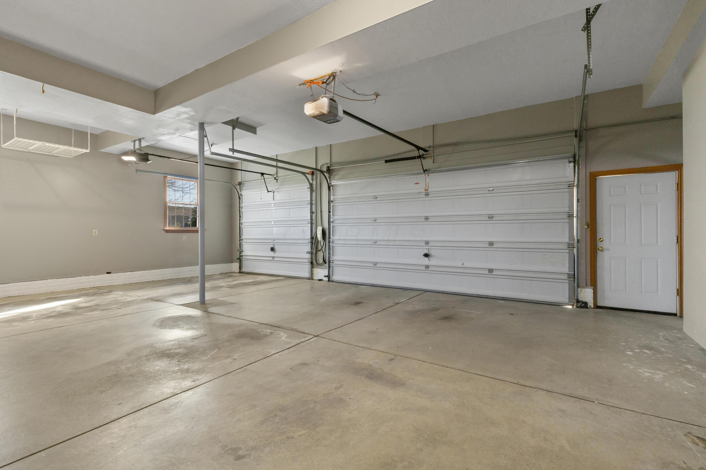 1364 Dale Ford Road Delaware, OH 43015 - Photo 11 of 112 • 3+ car attached • Side entry • Service door • Finished walls & ceiling • Liftmaster® electric door opener • New Wi-Fi electric door opener • Rough-in for Tesla® charger • Water spigot • Central vacuum