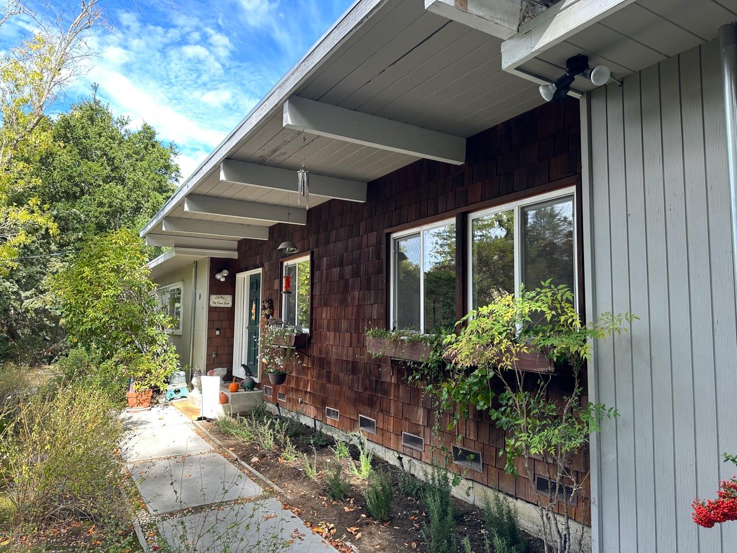 121 Escanyo Way Portola Valley, CA 94028 - Photo 1 of 2 a view of a porch with potted plants