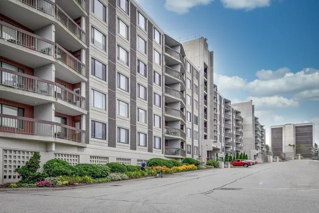 a city street lined with buildings and trees